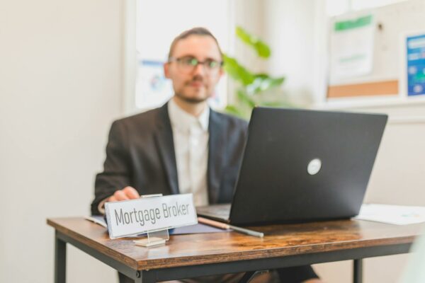 A Mortgage Broker Sitting Behind a Desk